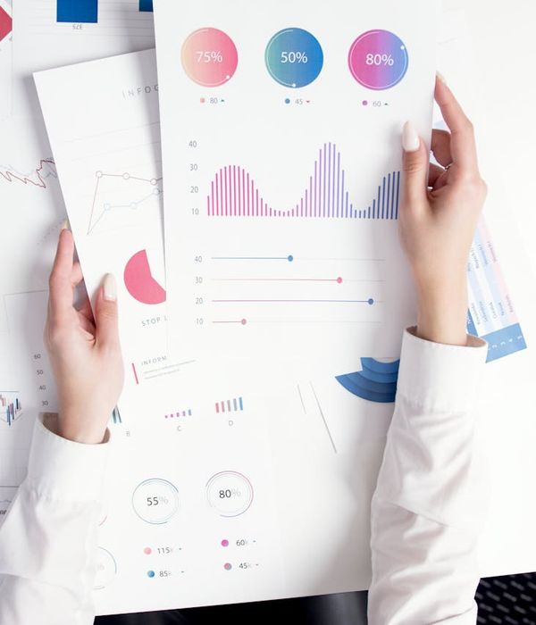 Data specialist analyzing comprehensive information dashboard with multiple metrics